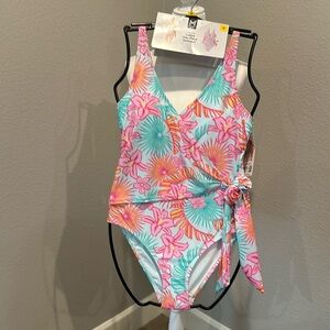 NWT one piece ladies swimsuit. size medium, wrap around look, adjustable strap